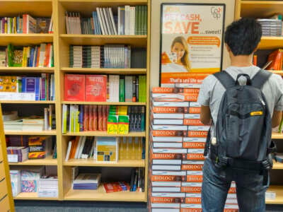 A student browses biology textbooks at the University of Melbourne on March 17, 2014 in Melbourne, Australia.