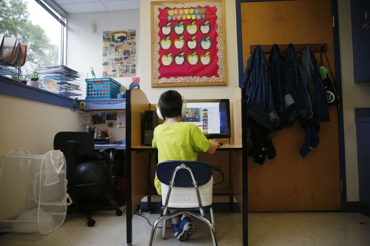 A boy watches YouTube videos as he takes a break during class at the New England Center for Children, a school for children with autism, in Southborough, Massachusetts, on September 6, 2017.