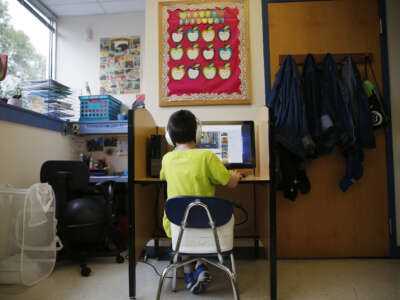 A boy watches YouTube videos as he takes a break during class at the New England Center for Children, a school for children with autism, in Southborough, Massachusetts, on September 6, 2017.