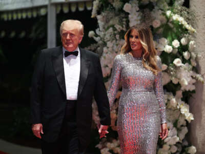 Donald Trump walks intoa fancy event with his wife