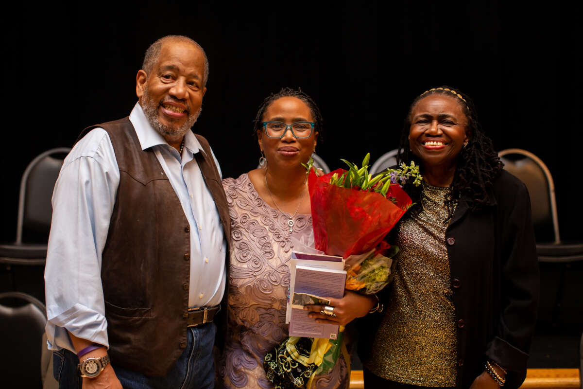 Michael Simmons (L), Gwendolyn Zoharah Simmons (R) and their daughter, Aisha Shahidah Simmons (center).