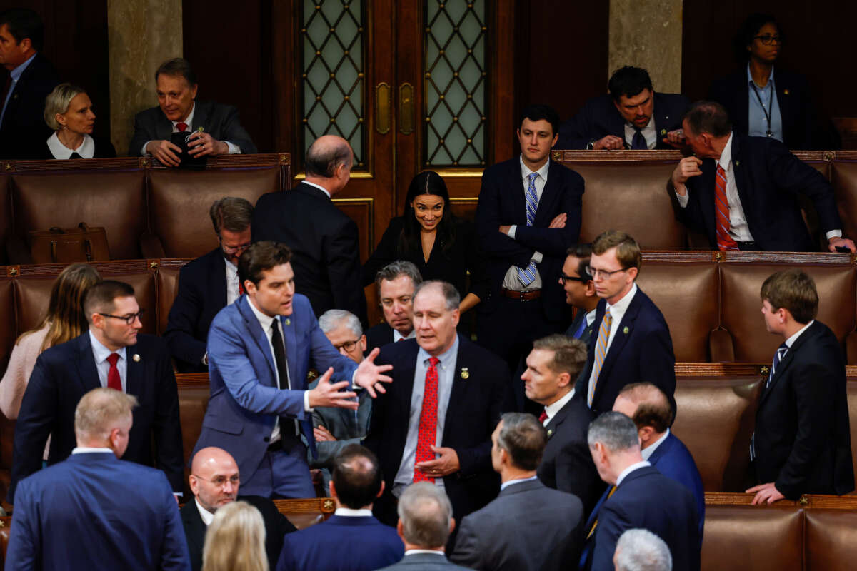 Rep.-elect Alexandria Ocasio-Cortez looks on as Republican House members-elects speak to one another during the second day of elections for Speaker of the House at the U.S. Capitol Building on January 4, 2023, in Washington, D.C.