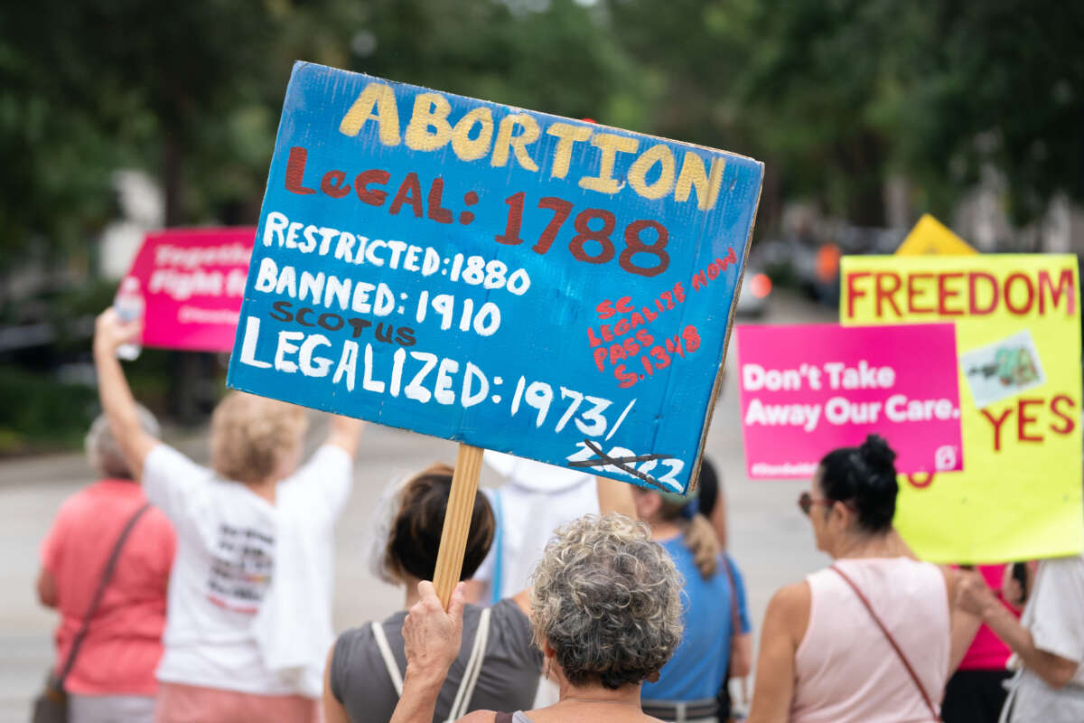 Demonstrators hold signs in front of the South Carolina Statehouse as lawmakers debate an abortion ban in Columbia, South Carolina, on August 30, 2022.