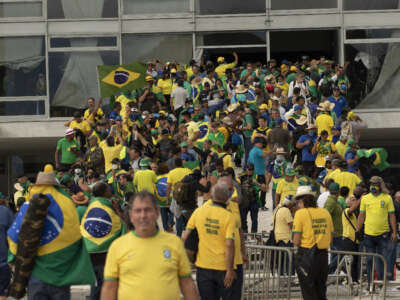 Supporters of former President Jair Bolsonaro clash with security forces as they raid governmental buildings in Brasilia, Brazil, on January 8, 2023.