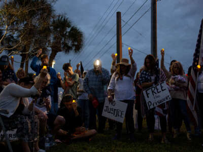 Supporters of former President Donald Trump gather to hold a protest rally and candlelight vigil in support of people arrested for their activities attacking the U.S. Capital exactly one year earlier, January 6, 2022, outside of the Pinellas County Jail in Clearwater, Florida.