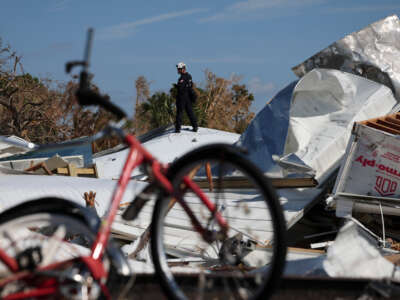 Members of the Virginia Task Force 2 Urban Search and Rescue team comb through the wreckage on Fort Myers Beach looking for victims of Hurricane Ian October 4, 2022, in Fort Myers Beach, Florida.