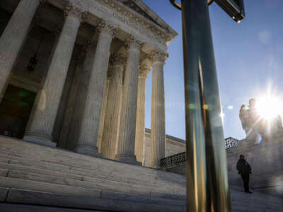 A U.S. Supreme Court police officer stands guard on the steps of the court in Washington, D.C. on December 28, 2022.