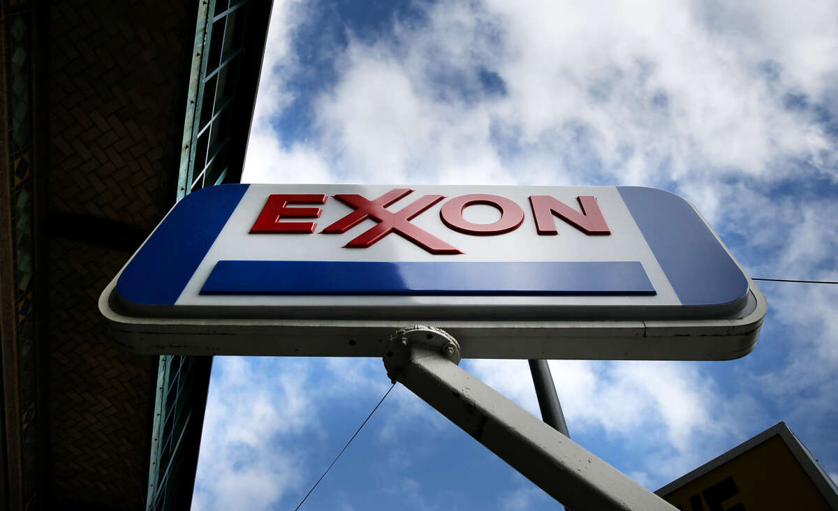A sign for an Exxon gas station stands in a Brooklyn neighborhood on October 28, 2016, in New York City.