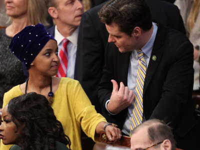 Rep.-elect Matt Gaetz, right, talks to Rep.-elect Ilhan Omar in the House Chamber during the third day of elections for Speaker of the House at the U.S. Capitol Building on January 5, 2023, in Washington, D.C.