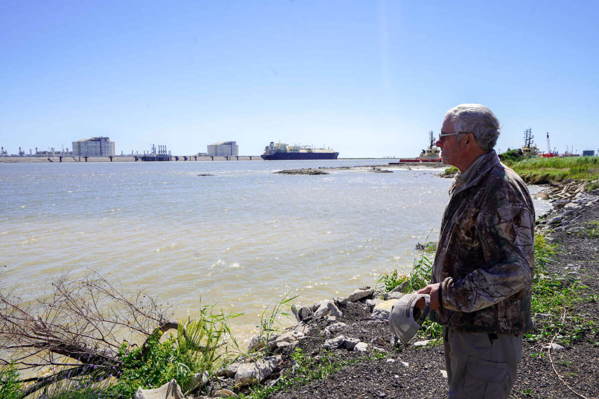 66-year-old retiree John Allaire stands in front of the Seapeak Magellan liquefied natural gas (LNG) tanker and Venture Global Calcasieu Pass LNG export terminal in Cameron, Louisiana, on September 29, 2022.