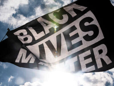 A Black Lives Matter flag waves during a demonstration outside the First Police Precinct Station on June 13, 2020, in Minneapolis, Minnesota.