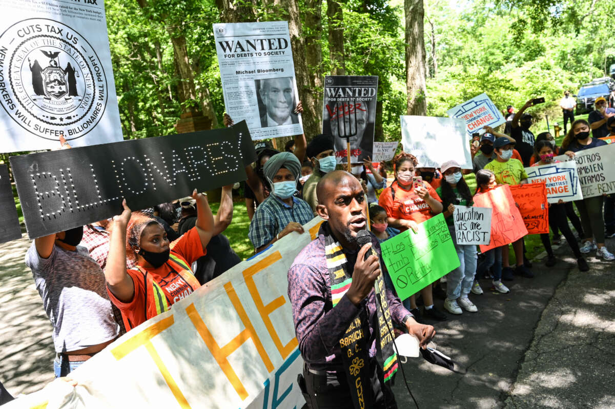 Jamell Henderson, a protest organizer, speaks outside of Michael Bloomberg's Southampton home demanding higher taxation of billionaires on July 1, 2020.