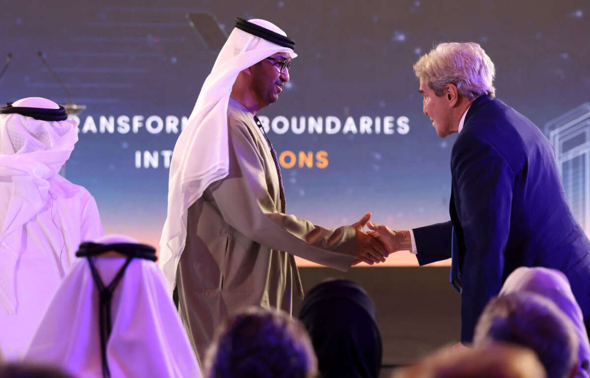 United Arab Emirates' Minister of State and CEO of the Abu Dhabi National Oil Company Sultan Ahmed al-Jaber, left, welcomes U.S. Presidential Envoy for Climate John Kerry at the opening session of the Atlantic Council Global Energy Forum, in Abu Dhabi, on January 14, 2023.