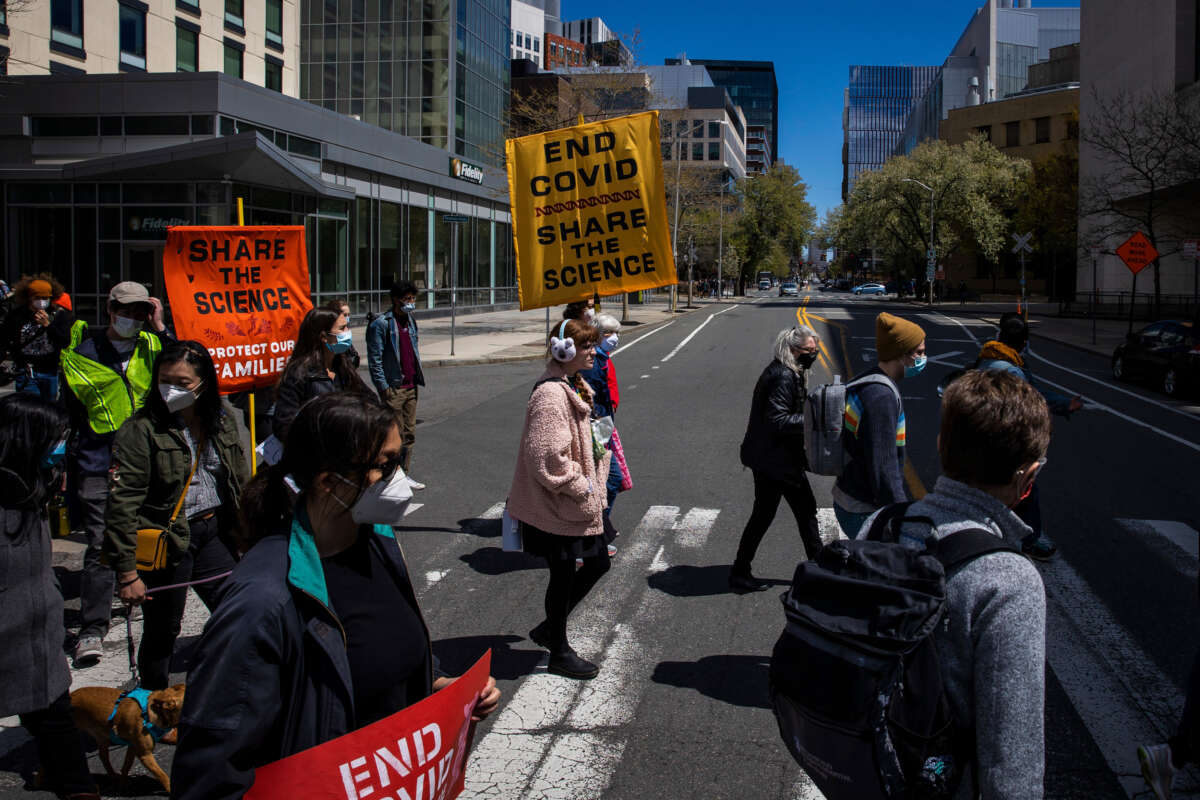 Dozens of demonstrators rally in front of Moderna's headquarters during its annual shareholder meeting in Cambridge, Massachusetts, on April 30, 2022.