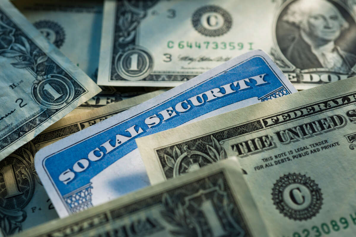 Social Security card mixed in with dollar bills
