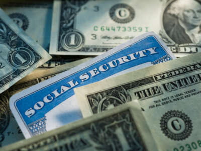 Social Security card mixed in with dollar bills