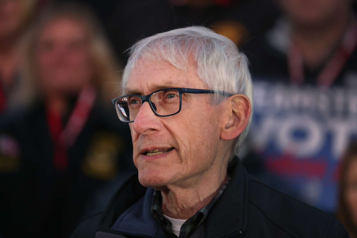 Wisconsin Gov. Tony Evers speaks to union workers at an event hosted by the Teamsters on the steps of the state capital building on November 7, 2022, in Madison, Wisconsin.
