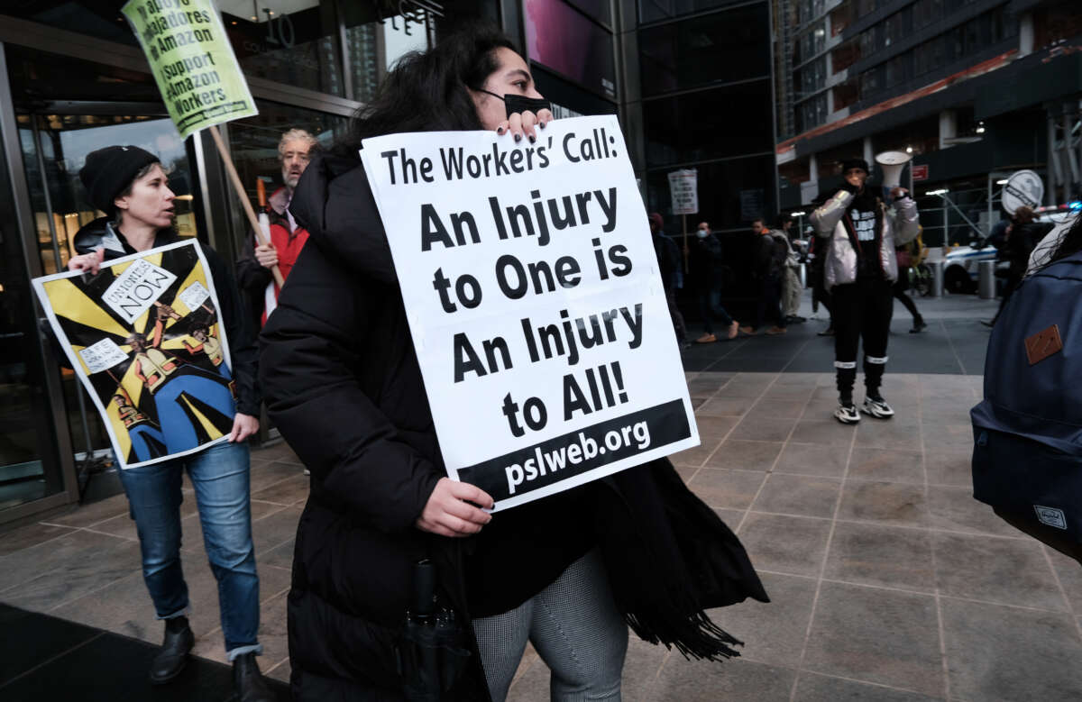 Members of the Amazon Labor Union and others protest outside of the New York Times DealBook Summit on November 30, 2022, in New York City.