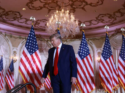 Former President Donald Trump leaves the stage after speaking during an event at his Mar-a-Lago home on November 15, 2022, in Palm Beach, Florida.