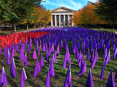Purple flags are displayed in front of Brigham & Womens Hospital, meant to represent the thousands of lives lost to drug overdoses, on October 28, 2022, in Boston, Massachussetts.