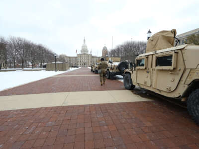 Michigan army national guard members station themselves outside of the Michigan state capitol