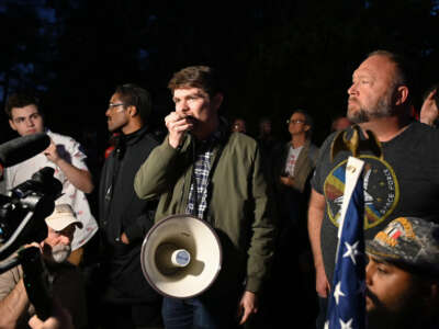 Nick Fuentes, Alex Jones and Ali Alexander are pictured during a 'Stop the Steal' broadcaster rally at the Governor's Mansion in Georgia on November 19, 2020.