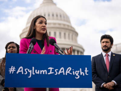 Flanked by Reps. Cori Bush and Greg Casar, Rep. Alexandria Ocasio-Cortez speaks during a news conference with Democratic lawmakers about the Biden administrations border politics, outside the U.S. Capitol on January 26, 2023, in Washington, D.C.