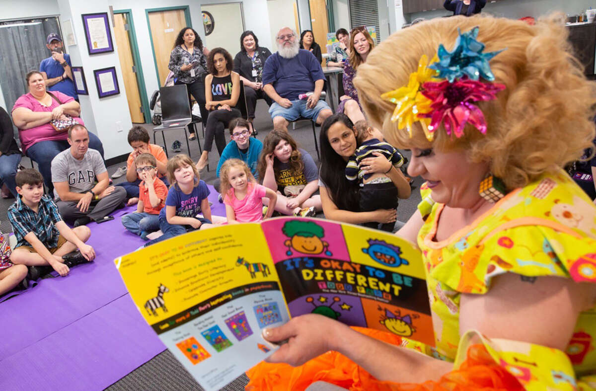 Rich Kuntz, also known as Gidget, reads to children during Drag Queen Story Hour on March 21, 2019.