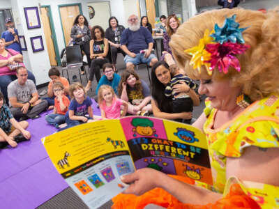 Rich Kuntz, also known as Gidget, reads to children during Drag Queen Story Hour on March 21, 2019.