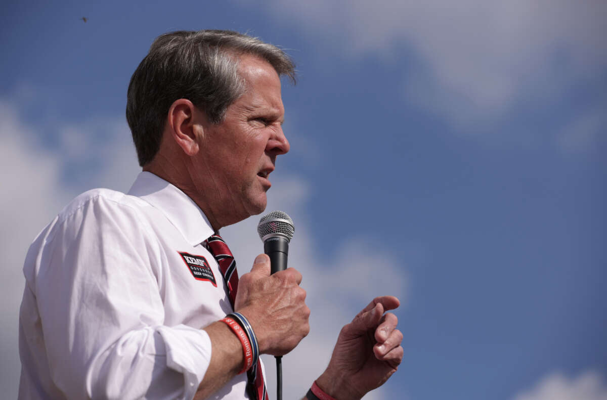 Gov. Brian Kemp speaks to voters during a campaign stop at Williamson Brothers Bar-B-Q on November 3, 2022, in Marietta, Georgia.