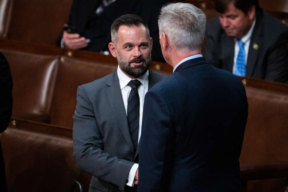 Rep.-elect Cory Mills, left, talks with Republican Leader Kevin McCarthy on the House floor after a vote in which McCarthy did not receive enough votes for Speaker of House on January 6, 2023.
