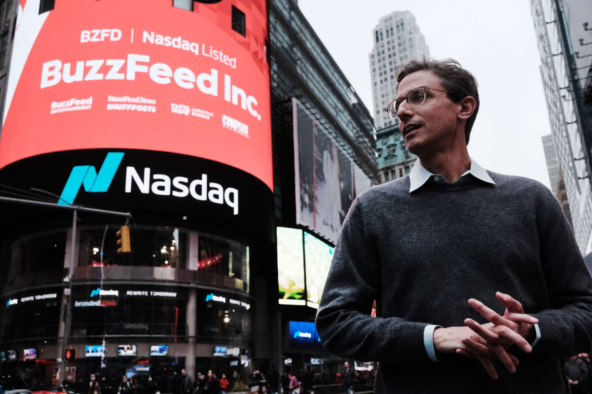 BuzzFeed CEO Jonah Peretti stands in front of the Nasdaq market site in Times Square as the company goes public through a merger with a special-purpose acquisition company on December 6, 2021, in New York City.