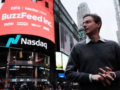 BuzzFeed CEO Jonah Peretti stands in front of the Nasdaq market site in Times Square as the company goes public through a merger with a special-purpose acquisition company on December 6, 2021, in New York City.