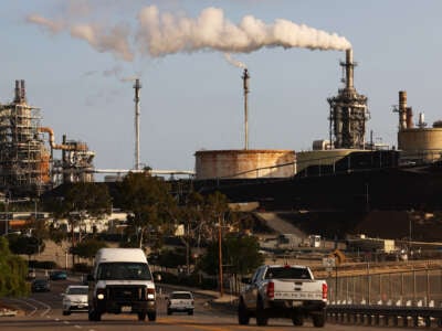 Vehicles pass the Phillips 66 Los Angeles Refinery Wilmington Plant on November 28, 2022, in Wilmington, California.