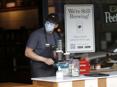 Peet's Coffee worker fills takeout orders for customers during the pandemic