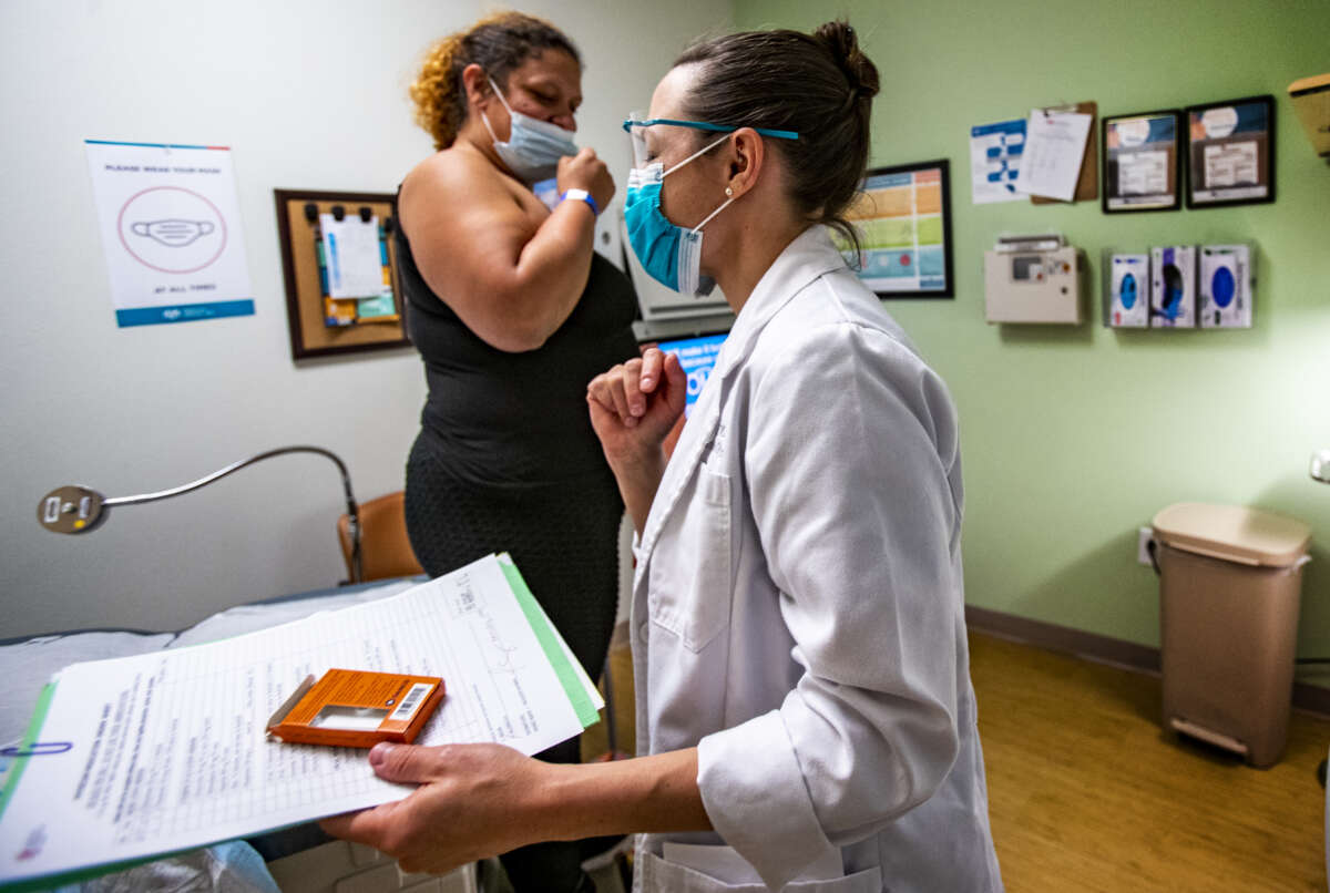 Dr. Lisa Hofler leaves the exam room after administering abortion medication to a patient at the Center for Reproductive Health in Albuquerque, New Mexico on June 21, 2022.