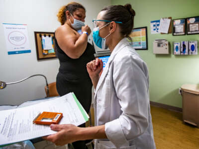 Dr. Lisa Hofler leaves the exam room after administering abortion medication to a patient at the Center for Reproductive Health in Albuquerque, New Mexico on June 21, 2022.