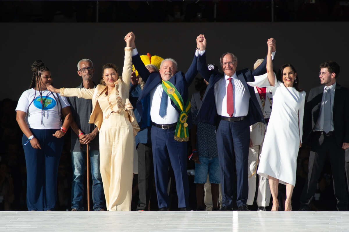 President of Brazil Luiz Inácio Lula da Silva waves to supporters alongside his wife Rosangela da Silva, Vice President Geraldo Alckmin and his wife Maria Lucia Ribeiro Alckmin after the presidential inauguration ceremony at Planalto Palace on January 1, 2023 in Brasilia, Brazil.