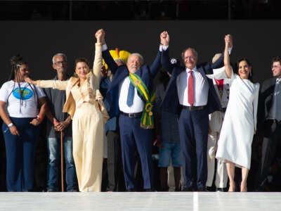 President of Brazil Luiz Inácio Lula da Silva waves to supporters alongside his wife Rosangela da Silva, Vice President Geraldo Alckmin and his wife Maria Lucia Ribeiro Alckmin after the presidential inauguration ceremony at Planalto Palace on January 1, 2023 in Brasilia, Brazil.