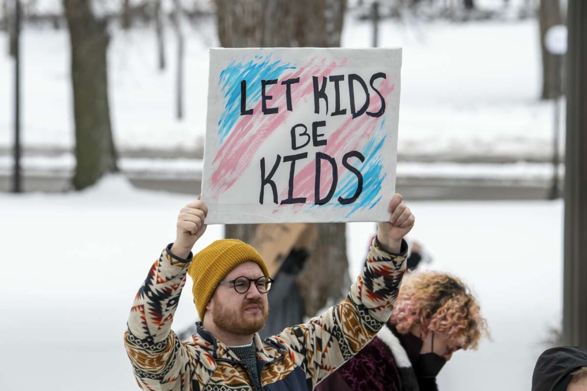 Protesters hold a rally at the Minnesota state capitol to support trans kids on March 6, 2022, in St. Paul, Minnesota.