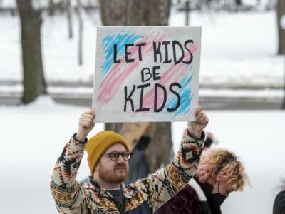 Protesters hold a rally at the Minnesota state capitol to support trans kids on March 6, 2022, in St. Paul, Minnesota.