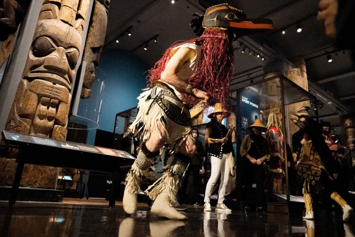 David Boxley (center), from the Laxsgyiik, Tsimshian people, and his grandson, Sage Sanidad (R), who is five-years-old, perform a traditional dance wearing ceremonial regalia at the newly revitalized Northwest Coast Hall at the American Museum of Natural History on May 5, 2022 in New York City.