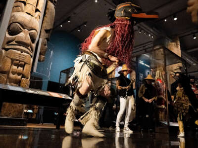 David Boxley (center), from the Laxsgyiik, Tsimshian people, and his grandson, Sage Sanidad (R), who is five-years-old, perform a traditional dance wearing ceremonial regalia at the newly revitalized Northwest Coast Hall at the American Museum of Natural History on May 5, 2022 in New York City.