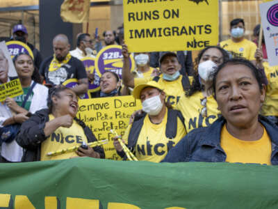 Farm workers with the Coalition of Immokalee Workers, and their supporters, call for a boycott of Wendy's outside of the Park Avenue offices of the chairman of Wendy's board, Nelson Peltz, on May 12, 2022 in New York City.