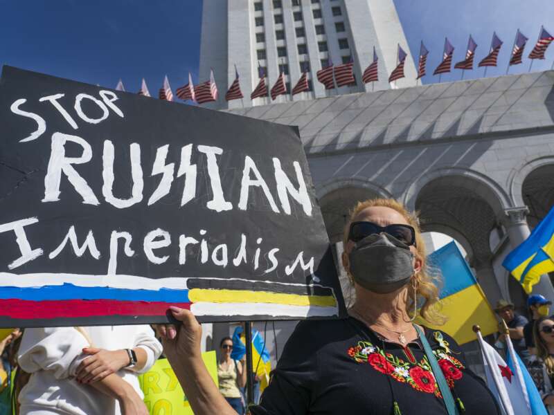 A protester holds a "Stop Russian Imperialism" sign at a rally in Los Angeles, California on March 19, 2022.