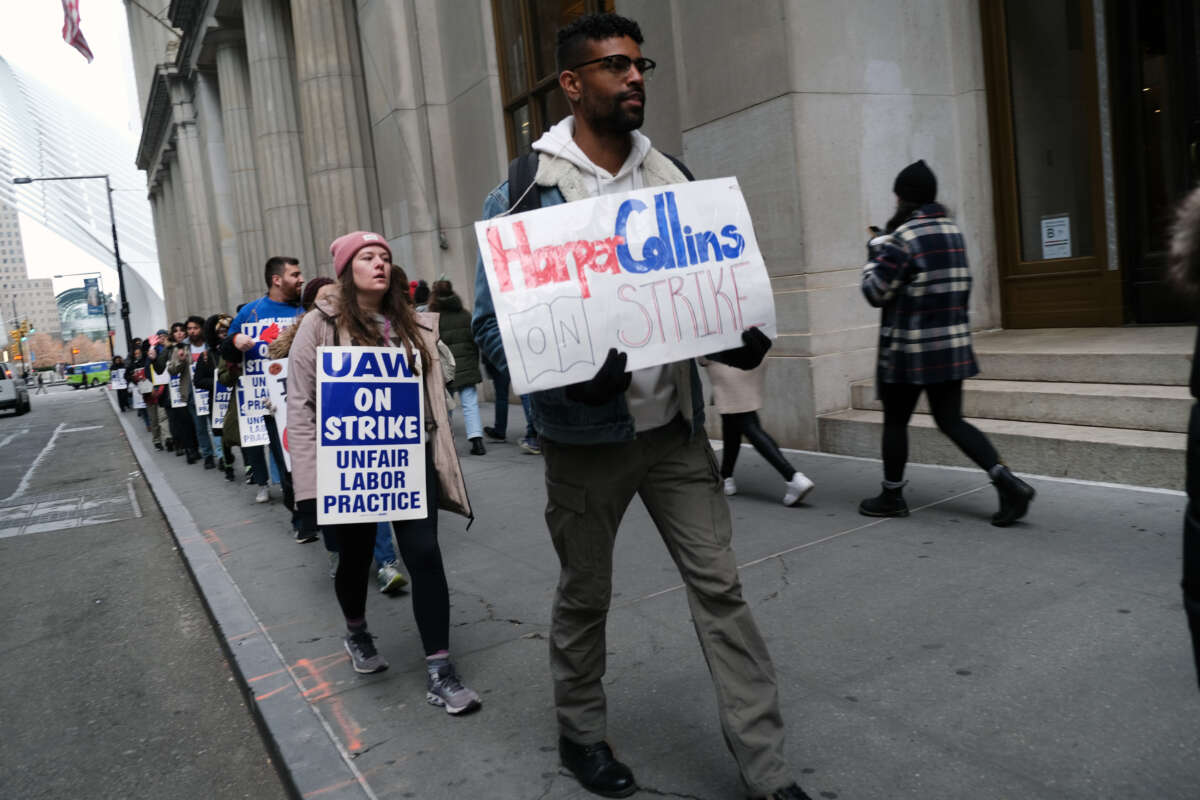 Employees of HarperCollins participate in a strike outside the company's offices on November 15, 2022, in New York City.