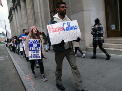 Employees of HarperCollins participate in a strike outside the company's offices on November 15, 2022, in New York City.