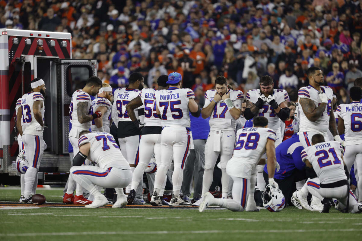 Buffalo Bills players react after teammate Damar Hamlin went into cardiac arrest during the first quarter of a game against the Cincinnati Bengals at Paycor Stadium on January 2, 2023 in Cincinnati, Ohio.
