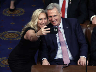 Rep.-elect Marjorie Taylor Greene takes a photo with U.S. House Republican Leader Kevin McCarthy after he is elected Speaker of the House in the House Chamber at the U.S. Capitol Building on January 7, 2023 in Washington, DC.