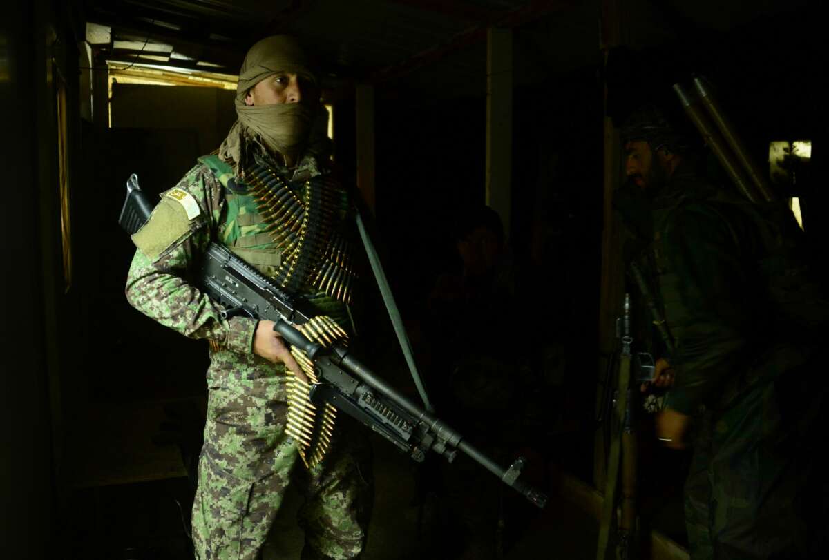 An Afghan Nation Army (ANA) soldier keeps watch as colleagues search a house during an operation in Bala Murghab district of Badghis province on March 26, 2017.